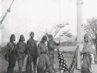 Japanese stage removing US flag on Corregidor island, The Philippines, during WW2