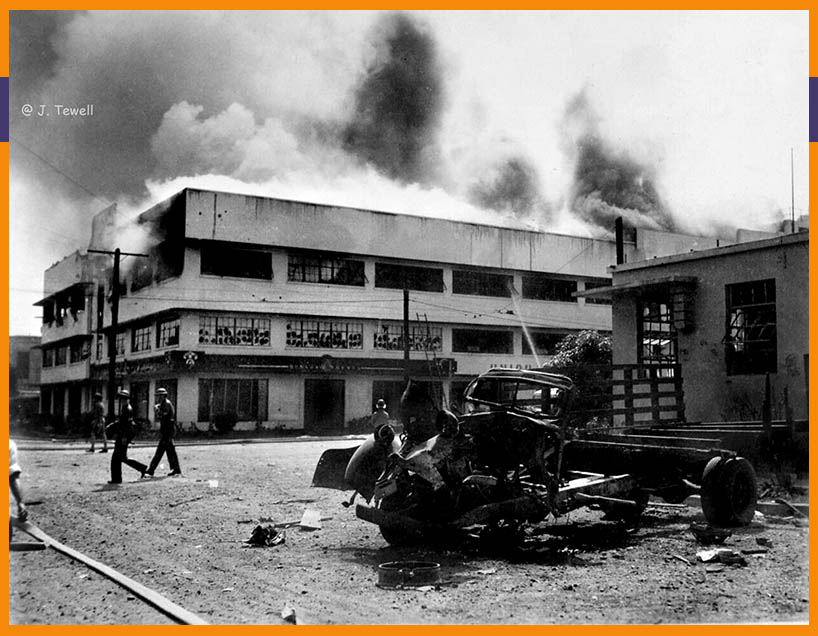 Burning Myers building in Manila after Japan bombing on December 24 1941
