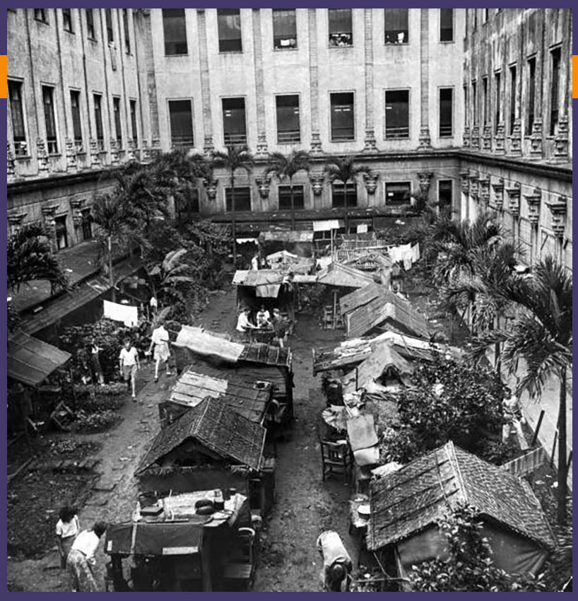 Shanties in courtyard of a building at Santo Tomas Civilian Internment Camp in Manila during WW2